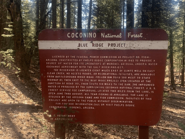 Sign explaining blue ridge project in forest